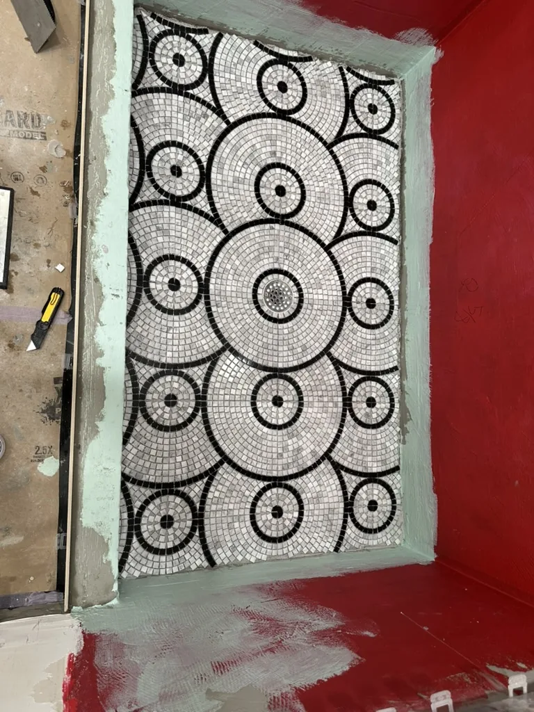 Circular mosaic shower floor during installation
