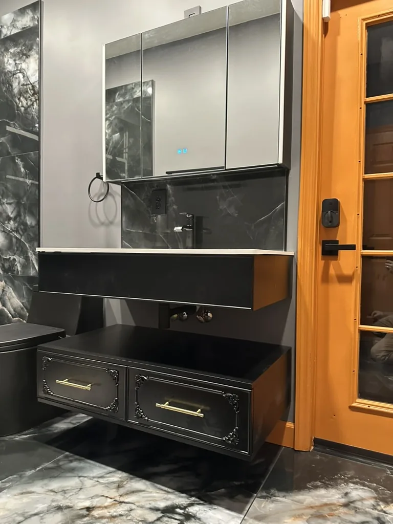 Mounted vanity drawers and mirrored storage in the shower bathroom