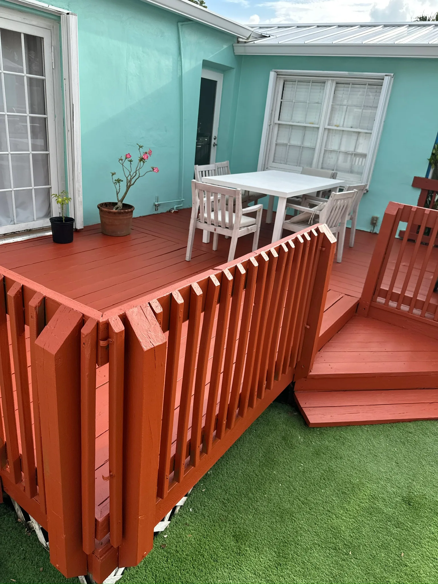 Completed painted deck entry steps and railings