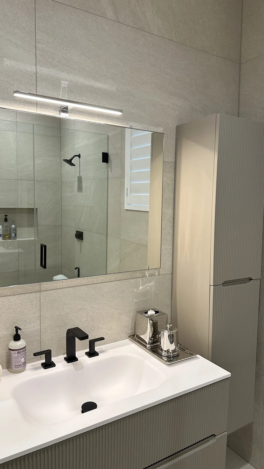 Bathroom vanity cabinet, mounted mirror, light, and tall storage cabinet